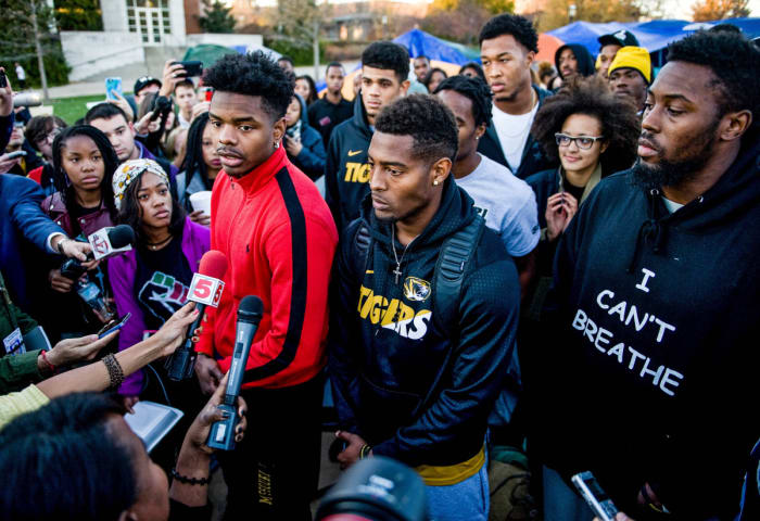 Moore (left), Simon (middle), Harris (right) and Ervin (behind, in glasses) were all key to the team’s protest.